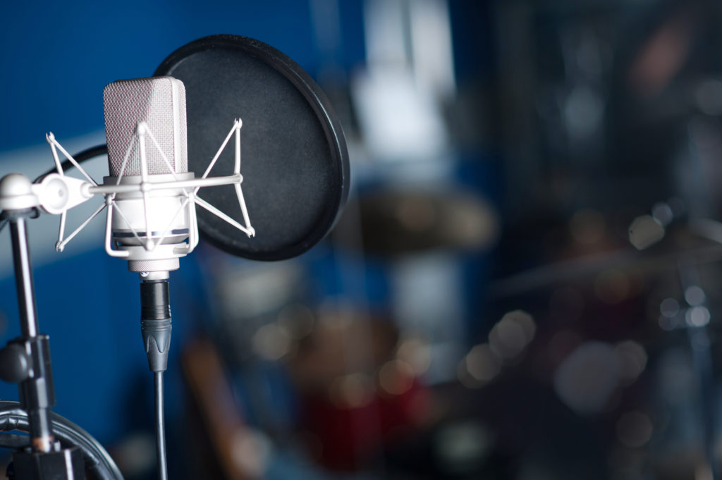Condenser microphone, recording studio shot.
